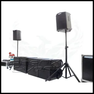 ouaf, le chien de Charlie, se cache derrière les caissons de basses d'un système de sonorisation Phenix Event