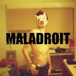 pochette du single maladroit, un homme porte un masque de cochon